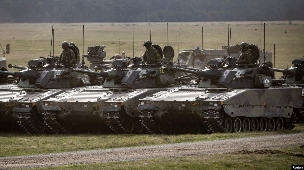 CV90 combat vehicles are seen during the Aurora 23 military exercise at Rinkaby firing range outside Kristianstad, Sweden, May 06, 2023. (TT News Agency/Johan Nilsson via Reuters)