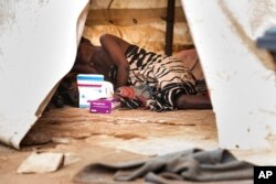 FILE - A cholera patient is seen inside an isolation ward at the Bwaila Hospital in Lilongwe central Malawi, Jan. 11, 2023.