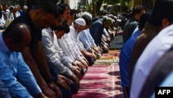 (FILE) Muslim devotees offer the first Friday prayers of Islam's holy fasting month of Ramadan in Karachi on March 15, 2024.