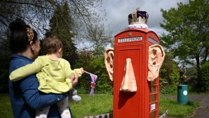 A refurbished telephone call box decorated with the ears and crown of King Charles III, is pictured in the village of Compton, Surrey, west of London, ahead of the coronation weekend.