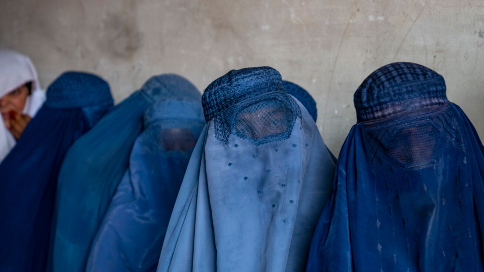 FILE - Afghan women wait to receive food rations distributed by a humanitarian aid group, in Kabul, Afghanistan, May 23, 2023. An NGO has urged the U.N. to demand the Taliban ensure full and equal participation of Afghan women in all discussions about Afghanistan's future. 