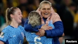 Millie Bright and manager Sarina Wiegman celebrate after England beat Australia on Aug. 16, 2023, in Sydney to earn a place in the final of the Women's World Cup.