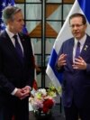 US Secretary of State Antony Blinken, left, and Israeli President Isaac Herzog talk in Tel Aviv, Israel, May 1, 2024.