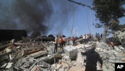 Palestinians look for survivors of the Israeli bombardment of the Gaza Strip in Rafah, Oct. 23, 2023.