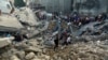 Palestinians inspect the site where there was a nearly 900-year-old Greek Orthodox church, destroyed following Israeli airstrikes on Gaza City, Oct. 20, 2023.