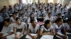 FILE - In this Aug. 5, 2010, photograph, students attend an entrance-exam class in Kota, India.