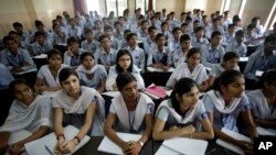 FILE - In this Aug. 5, 2010, photograph, students attend an entrance-exam class in Kota, India.