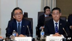 South Korea's Minister of Foreign Affairs Cho Tae-yul, left, and South Korea's National Defense Minister Shin Won-sik sit during an Australia and South Korea Foreign and Defense Ministers meeting in Melbourne, Australia, May 1, 2024. 