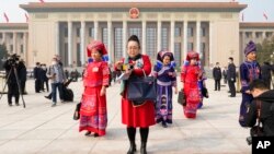 Delegates leave after the opening session of China's National People's Congress (NPC) at the Great Hall of the People in Beijing, March 5, 2023.