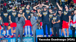 Basketball Africa League President Amadou Gallo Fall presents Al Ahly of Egypt the 2023 BAL Championship trophy at the BK Arena in Kigali, Rwanda, May 27, 2023