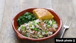 Collard greens, cornbread and black-eyed peas are foods some Americans eat on New Year's Day in hopes of attracting luck and prosperity in the new year. (Stock photo)