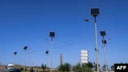 FILE - This picture taken on October 20, 2022 shows a view of solar panels used to power road lights on the way to Bizerte, near the northernmost point of Tunis and the African continent. 