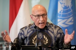 FILE - Tom Andrews, the U.N. Special Rapporteur on the situation of human rights in Myanmar, gestures as he speaks to the media during a press conference in Jakarta, Indonesia, June 21, 2023.