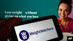 This image shows the logo of WeightWatchers and the company's website, in New York, March 7, 2023. The company said this week it was getting into the prescription drug weight loss business with the acquisition of a telehealth company whose providers prescribe them.
