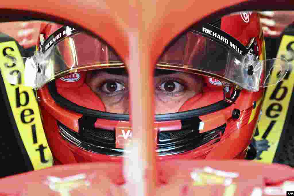 Ferrari's Spanish driver Carlos Sainz sits his car in the pits prior to the first practice session on the Red Bull Ring race track in Spielberg, Austria, ahead of the Formula One Austrian Grand Prix.