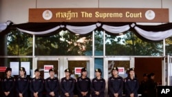 FILE - Thai police officers stand guard outside the Supreme Court in Bangkok, Sept. 27, 2017. 