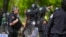 University of Chicago police stand between pro-Palestinian and pro-Israel protesters on the fifth day of a pro-Palestine encampment on campus, May 3, 2024, in Chicago. 