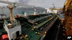 FILE - Iranian oil tanker Fortune is anchored at the dock of the El Palito refinery near Puerto Cabello, Venezuela, May 25, 2020.