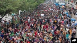 People participate in a protest march against Prime Minister Sheikh Hasina and her government to demand justice for the victims killed in the recent countrywide deadly clashes, in Dhaka, Bangladesh, Aug. 3, 2024.