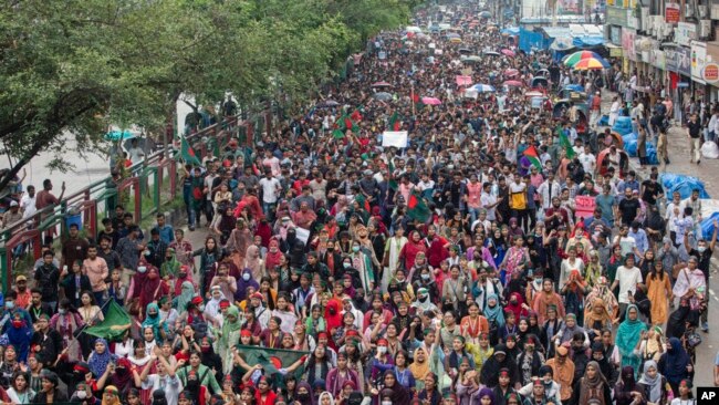 People participate in a protest march against Prime Minister Sheikh Hasina and her government to demand justice for the victims killed in the recent countrywide deadly clashes, in Dhaka, Bangladesh, Aug. 3, 2024.