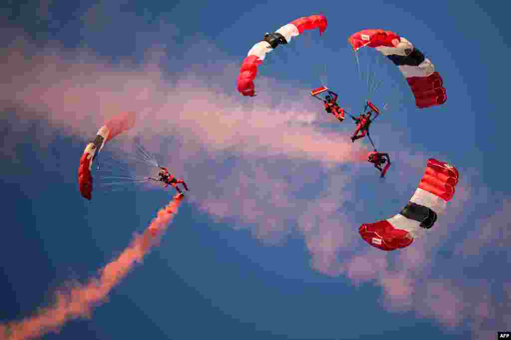 Parachutists perform as they descend to Utah Beach on June 6, 2024, during the &quot;D-Day&quot; commemorations marking the 80th anniversary of the World War II Allied landings in Normandy.&nbsp;