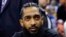 FILE - Rapper Nipsey Hussle attends an NBA basketball game in Oakland, Calif., March 29, 2018. 