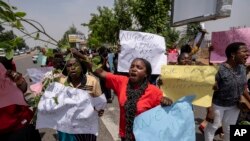 Demonstrators accusing the election commission of irregularities and disenfranchising voters make a protest in downtown Abuja, Nigeria Tuesday, Feb. 28, 2023.