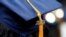 FILE - A tassel with 2023 on it rests on a graduation cap as students walk in a procession for Howard University's commencement in Washington, May 13, 2023.