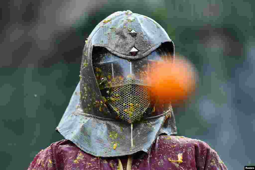 A person participates in the annual &#39;Battle of the Oranges&#39; in the northern city of Ivrea, Italy.