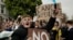 FILE - Chelsea fans protest outside Stamford Bridge stadium in London, against Chelsea's decision to be included amongst the clubs attempting to form a new European Super League, Tuesday, April 20, 2021. 