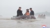 North Korean leader Kim Jong Un and Premier Kim Tok Hun visit a flood-affected area near the border with China, in North Pyongan province, in this undated photo released July 31, 2024 by North Korea's official Korean Central News Agency.