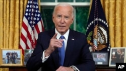 President Joe Biden addresses the nation from the Oval Office of the White House in Washington, July 24, 2024, about his decision to drop his Democratic presidential reelection bid. (Pool via AP)