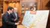 Lebanese Parliament Speaker Nabih Berri, right, shows a map that details Israel's strikes on Lebanon since Oct. 7, to visiting French Foreign Minister Stephane Sejourne during their meeting, in Beirut, April 28, 2024. 