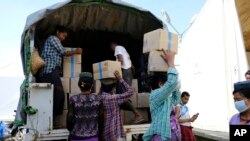 This image provided by World Food Program shows relief food commodities being stockpiled at WFP warehouses in Rakhine State, Myanmar.