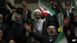 Supporters of a group of candidates chant slogans during their election campaign rally ahead of the March 1 parliamentary and Assembly of Experts elections, in Tehran, Iran, Feb. 28, 2024.