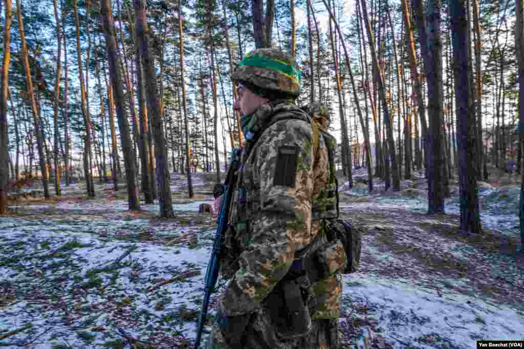 A soldier patrols the forest around Kharkiv, where the Ukrainian army created a series of defensive lines, Feb. 17, 2023.