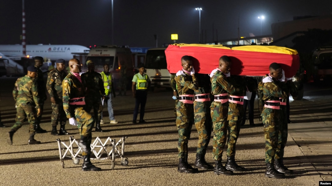 The body of late Ghanaian soccer player, Christian Atsu Twasam, 31, who died in the earthquake in Turkey, arrives at the Kotoka International Airport in Accra, Ghana. Feb. 19, 2023.