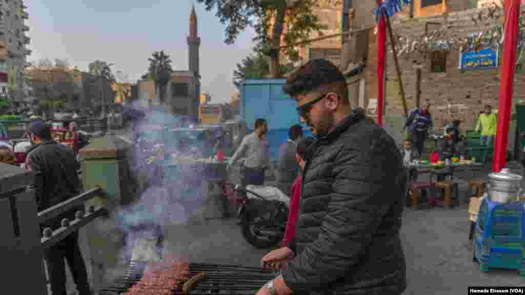 Youssef, whose business-owning family has put on charity iftars for 36 years, says, “We usually serve pieces of meat, but this year, we’re only offering rissoles [roasted meat with herbs and beans] so more people can eat.” (Hamada Elrasam/VOA)