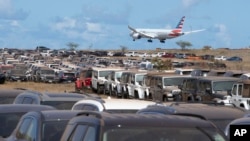 Unused rental cars are parked in an overflow lot at Kahului Airport in Kahului, Hawaii, on Aug, 14. 2023.