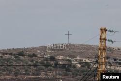 The Rmeich sign is seen, amidst tension between Israel and Hezbollah, in the Christian village of Rmeish, Lebanon, Oct. 31, 2023