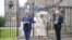 FILE - Britain's King Charles III, left, and Queen Camilla, center, unveil a plaque to mark the Platinum Jubilee of Queen Elizabeth II, at the Palace of Holyroodhouse, in Edinburgh, Scotland, July 4, 2023. 