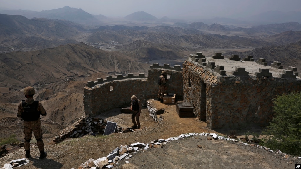 FILE - Pakistan army troops observe the area from hilltop post on the Pakistan-Afghanistan border, Aug. 3, 2021. Pakistan says increased terrorist attacks from the neighboring country are straining an already difficult bilateral relationship.