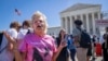 Celeste McCall, of Washington, reacts in confusion, July 1, 2024, outside the Supreme Court in Washington after decisions were announced.