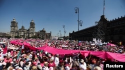People take part in a protest in support of the National Electoral Institute (INE) and against President Andres Manuel Lopez Obrador's plan to reform the electoral authority, in Mexico City, Mexico, Feb. 26, 2023. 