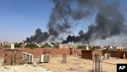 In this photo provided by Maheen S, smoke fills the sky in Khartoum, Sudan, near Doha International Hospital on April 21, 2023. 