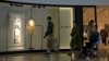 FILE - A man with a shopping bag leaves a ZARA flagship store at a mall in Bejing, June 21, 2023. Foreign companies are shifting investments and their Asian headquarters out of China as confidence in the business climate drops.