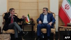 A picture from Iran's Atomic Energy Organization shows Iranian Atomic Organization spokesman Behrouz Kamalvandi, right, with International Atomic Energy Agency head Rafael Grossi in Tehran, March 3, 2023. AFP PHOTO/Atomic Energy Organization of Iran