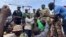 FILE - Mohamed Toumba, one of the soldiers who ousted Nigerian President Mohamed Bazoum, addresses supporters of Niger's ruling junta in Niamey on Aug. 6, 2023. The junta ordered its armed forces to go on highest alert on Aug. 25, 2023.