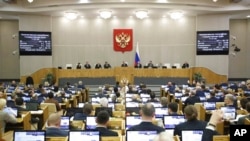 FILE - Lawmakers attend a session at the State Duma, the lower house of the Russian parliament, in Moscow, Feb. 22, 2023.