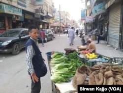 A street vendor sells produce on Palestine Street in Hasaka, Syria, March 22, 2024.